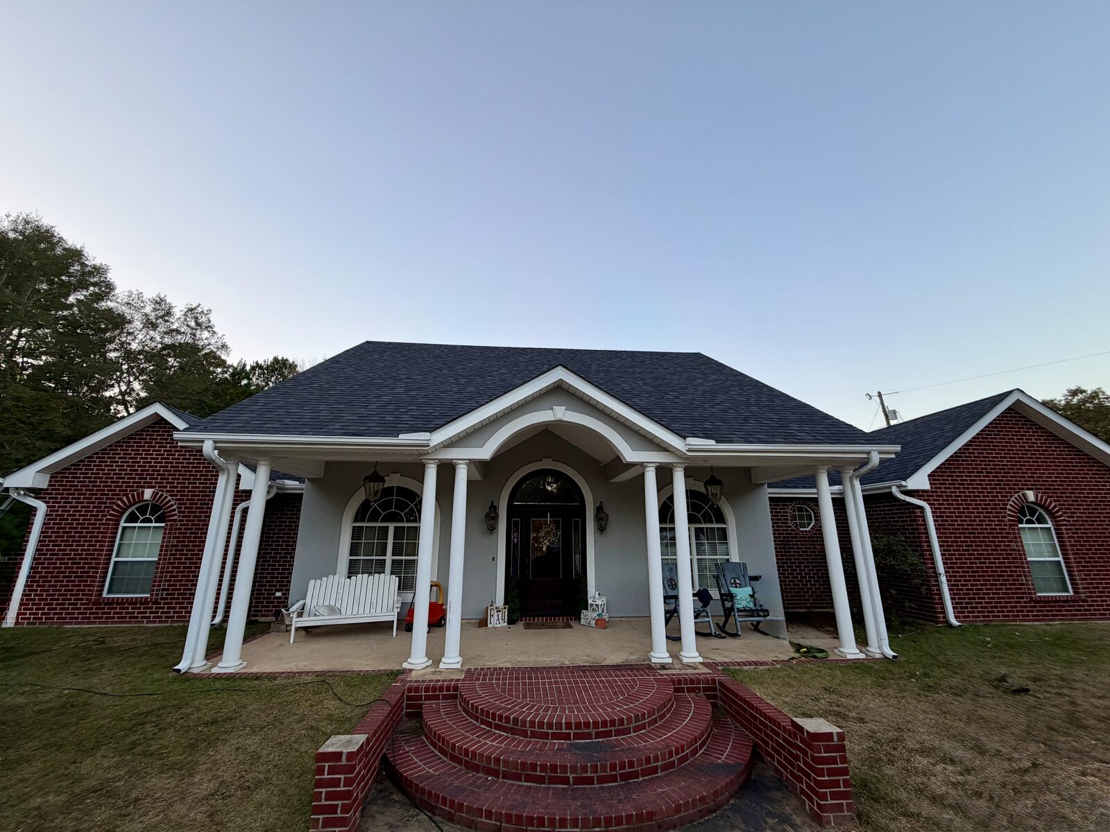 New shingle roof on a columned brick home in Leesville, Louisiana