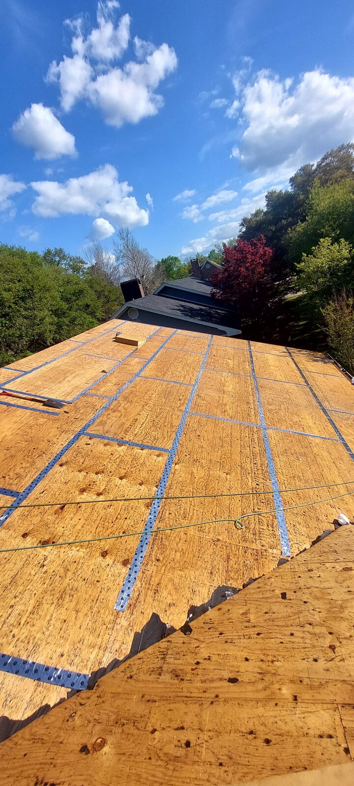 New roof decking with synthetic underlayment installed on a Louisiana home