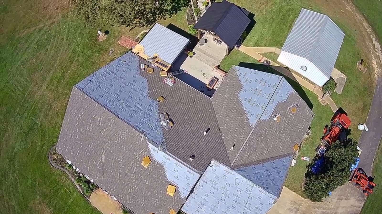 Aerial view of a hail claim roof replacement in progress in Alexandria, Louisiana